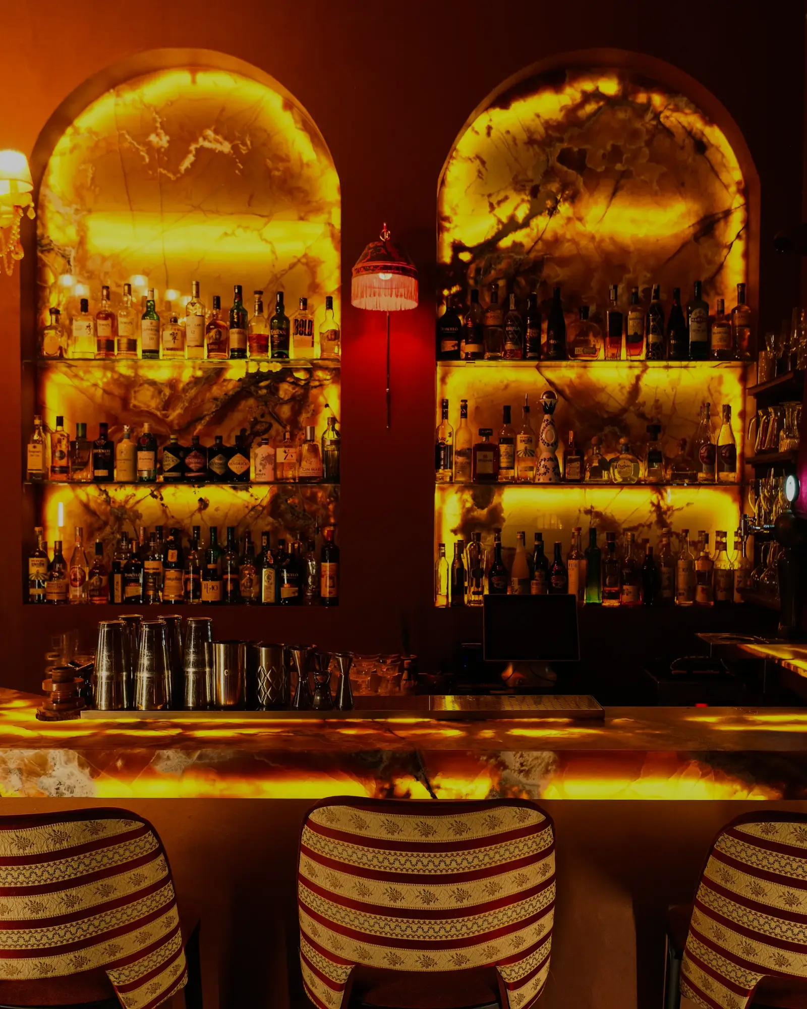 The back bar at Patara, glowing with bottles