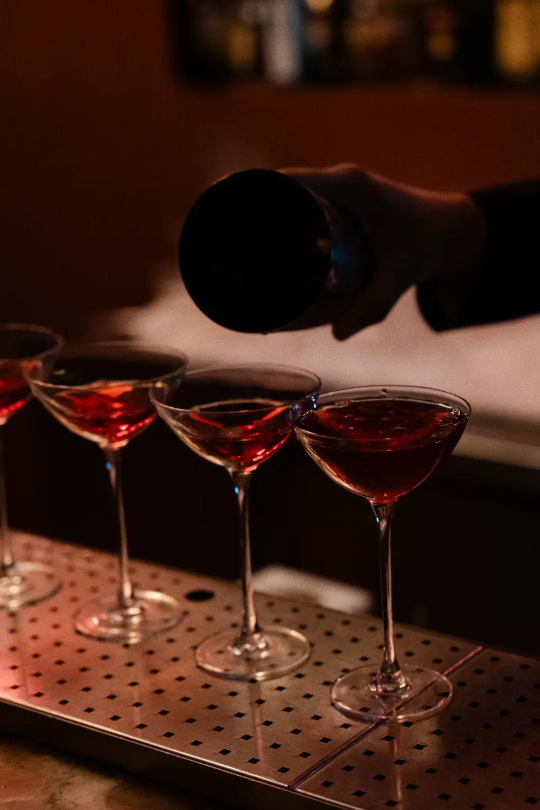A Patara signature cocktail poured ready to serve into coupe glasses