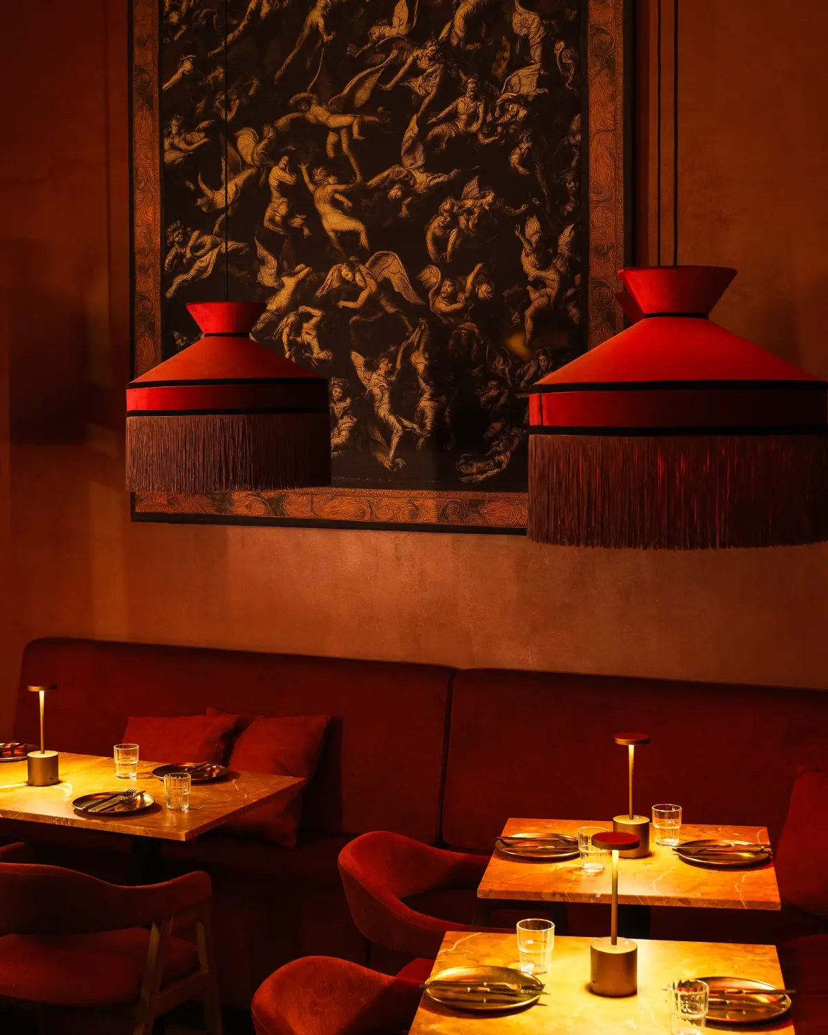 Front room with set tables under the fringed lamps